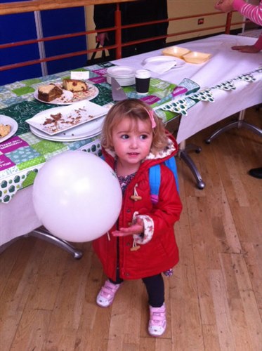 An image of Poppy and a Macmillan balloon