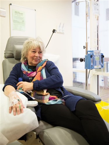 Photograph showing a lady having chemotherapy