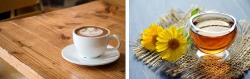 One cup of coffee and a cup of tea next to some yellow flowers