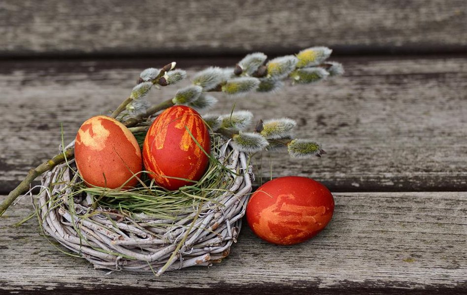 An image of some painted eggs with willow branches