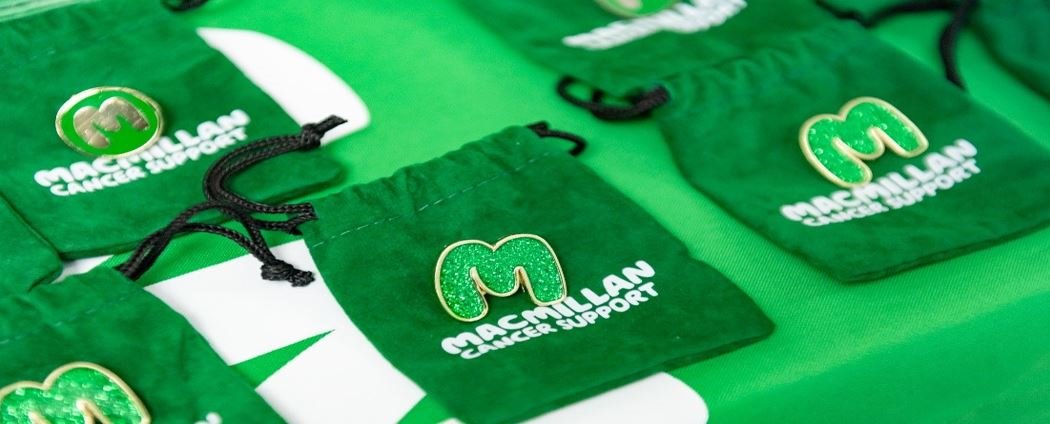 Green Macmillan M badge