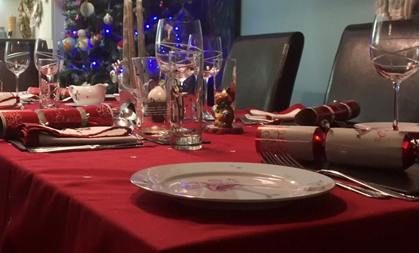  A festive dinner table with plates and glasses 