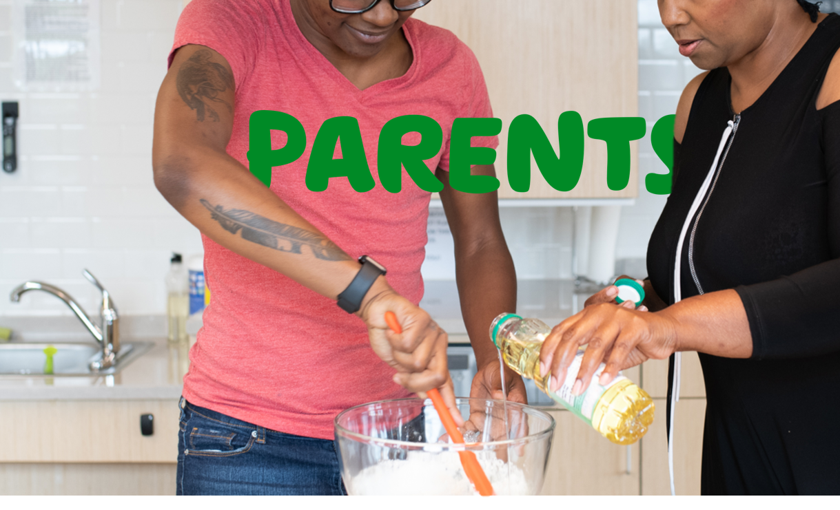 "Parents" written over a picture of two people putting ingredients into a mixing bowl in their kitchen.