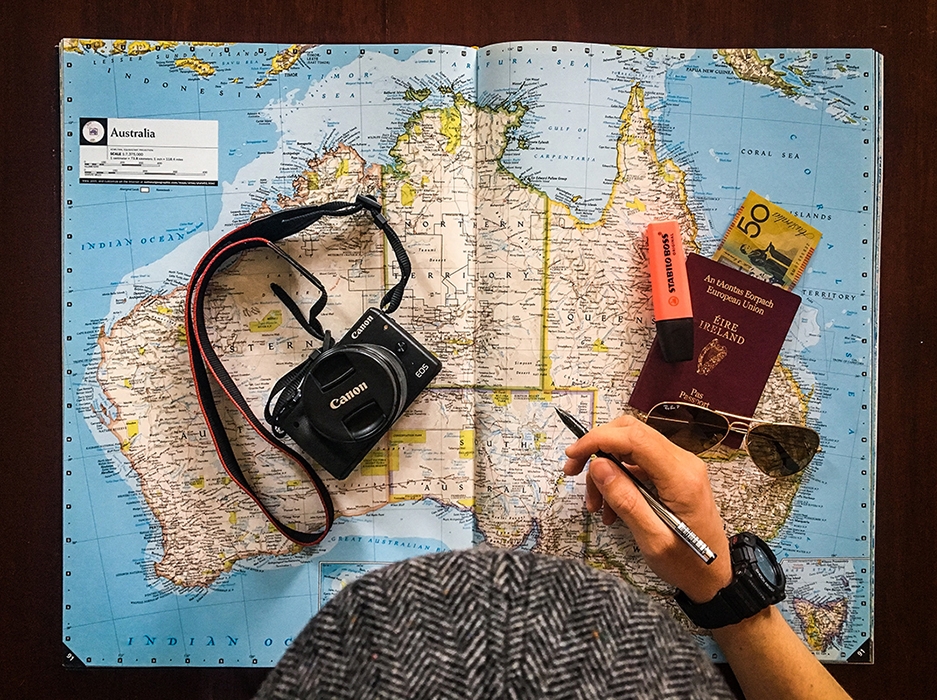 Man looking over a map of Australia