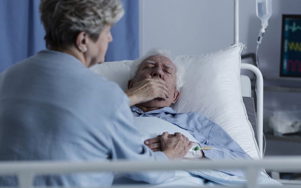 Lung Cancer patient being comforted in bed
