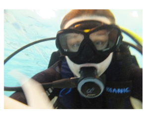A picture of Gbear in the water, in scuba diving equipment