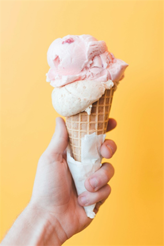  a cone with pink and white ice cream