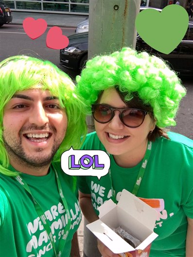 The photo shows editors Lauren and Sofiane wearing bright green wigs!