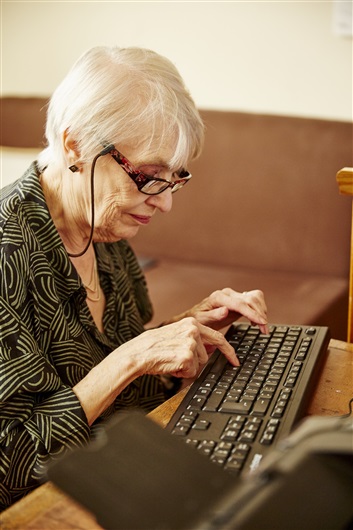 This is an image of Frances, an older person, using her computer.