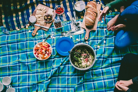 Picnic food on a blue tartan blanket