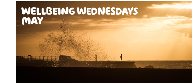  "Wellbeing Wednesday - May" written over a picture of a person standing alone, at the edge of a pier, amidst a beautiful sunset.