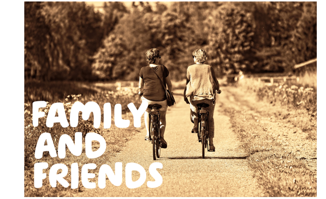  "Family and friends" written over a sepia picture of two women riding bikes down a country lane