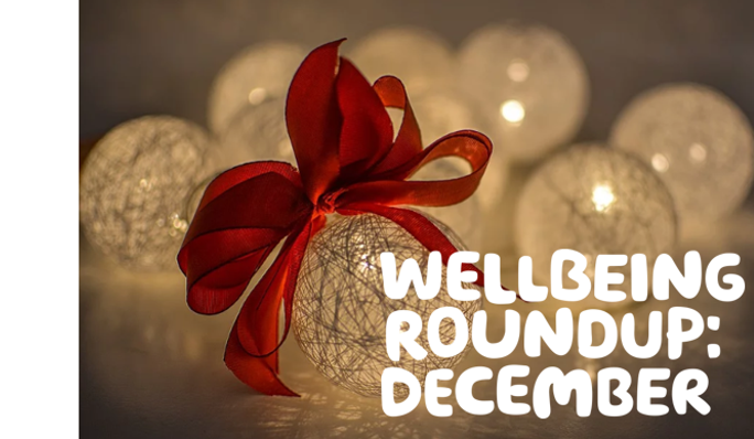  'Wellbeing roundup: December' written in white over a festive image of Christmas baubles