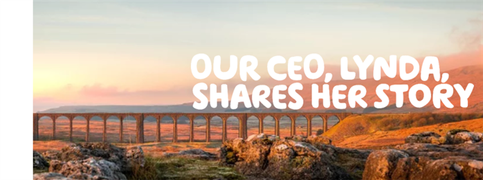  “Our CEO, Lynda, shares her story” written in white across an orange landscape, an aqueduct over moorland.