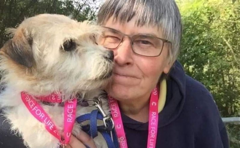 A photo of Mary with a small dog