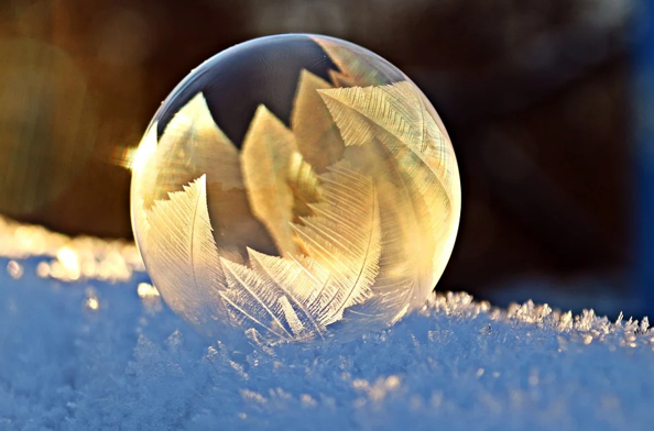 An image of a bubble in snow, showing ice formations