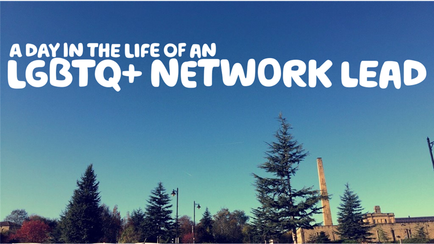 "A day in the life of an LGBTQ+ Network Lead" written over a blue sky and pine trees, with an old mill in the background.